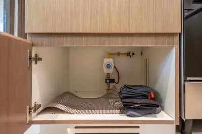 a toy kitchen with a drill in a cabinet at Stunning 1 Bedroom Panoramic Views at Burj Royale in Dubai