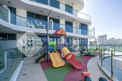 a playground on the side of a building at Bloomfields Classic 2Br With Private Pool Samana in Dubai