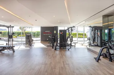 a gym with treadmills and cardio equipment in a building at Opalz by Danube,Dubai Science Park - Studio Apartment - Allsopp & Allsopp in Dubai