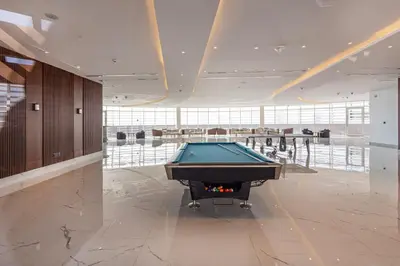a billiard room with a pool table in a building at Opalz by Danube,Dubai Science Park - Studio Apartment - Allsopp & Allsopp in Dubai