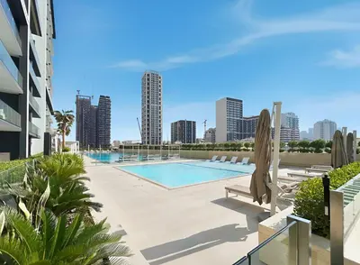 a swimming pool with a view of the city at BLVD Luxury 2BHK with Private Pool Near Circle Mall in Dubai