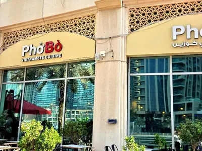a store front of a building with a photo box sign at Marina Residence tower A in Dubai