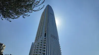 a tall building with a blue sky in the background at Address Point Tower 2 in Dubai