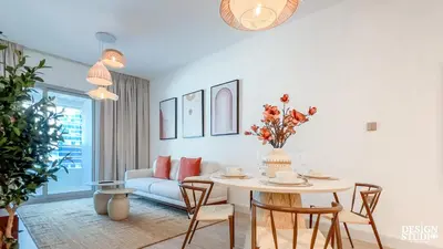 a living room with a table and a couch at MARINA DIAMOND 6 by Design Studio in Dubai
