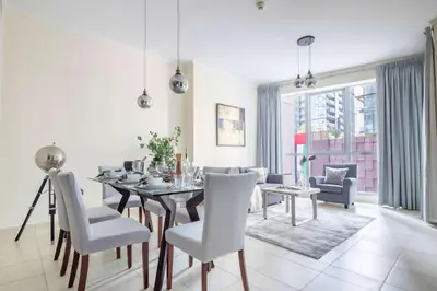 a dining room with a table and chairs at Frank Porter - Torch Tower Marina in Dubai