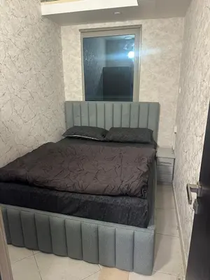 a large bed in a bedroom with a mirror at Marina Princess Tower Dubai Apartment in Dubai