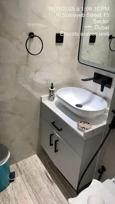 a bathroom with a white sink and a mirror at MARINA VIEW TOWER a WING in Dubai