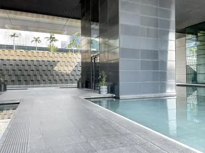 a building with a pool in the middle of it at Blueground DIFC pool gym DXB-505 in Dubai