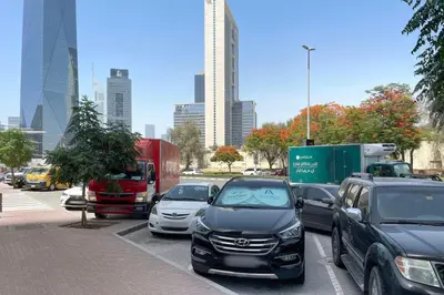 a bunch of cars parked in a parking lot at Blueground DIFC pool gym DXB-505 in Dubai