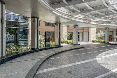 an empty lobby of a building with a walkway at Blueground Icon Tower city view gym parking DXB-1332 in Dubai