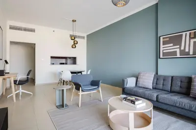 a living room with a couch and a table at Blueground JLT pool gym nr Marina JBR DXB-1616 in Dubai