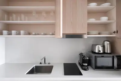 a kitchen with a sink and a microwave at Blueground The Palm Jumeirah jacuzzi nr Atlantis DXB-1708 in Dubai