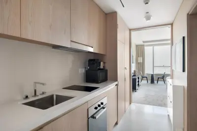 a kitchen with a sink and a stove top oven at Blueground The Palm Jumeirah pool nr Marina DXB-1711 in Dubai