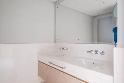 a bathroom with a sink and a mirror at Blueground The Palm Jumeirah pool nr Atlantis DXB-1717 in Dubai
