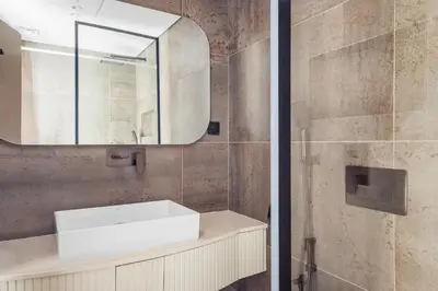 a bathroom with a sink and a mirror at Blueground Downtown Dubai pool nr Burj Khalifa DXB-1735 in Dubai