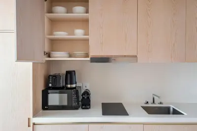 a kitchen with a microwave and a coffee maker at Blueground The Palm Jumeirah pool nr Atlantis DXB-1722 in Dubai
