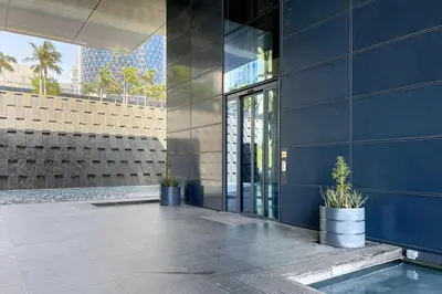 a blue building with potted plants in front of it at Blueground DIFC pool nr Dubai Mall DXB-1743 in Dubai