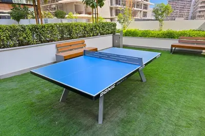 a ping pong table on the roof of a building at Estudio Amira en Dubai by beBalmy in Dubai