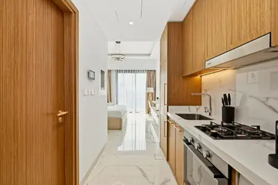 a kitchen with a sink and a stove at Estudio Amira en Dubai by beBalmy in Dubai