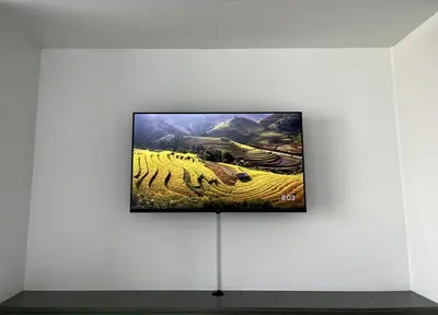 a flat screen tv on a wall in a museum exhibit at Stunning New Studio - Near Dubai Hills Mall in Dubai