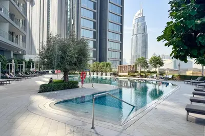 a swimming pool in a city with tall buildings at PVH - Burj Khalifa View 2BR - Vida Dubai Mall in Dubai