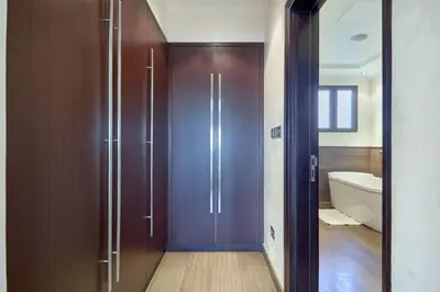 a bathroom with a shower and a bath tub at JuliusHomes-Villa Noor in Dubai