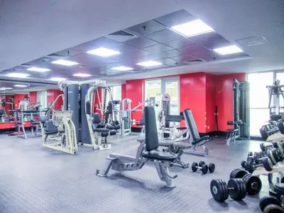 a gym with a lot of equipment in a room at Elegant 1BR with Balcony in Dubai Marina by EE Holiday Homes in Dubai