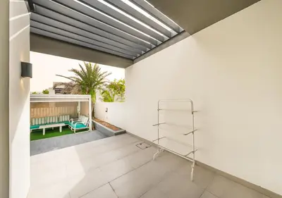 a living room with white walls and a ceiling at Luxury Maple 3 Villa in Dubai Hills with Private Garden in Dubai