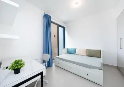 a white room with a bed and a table at Luxury Maple 3 Villa in Dubai Hills with Private Garden in Dubai
