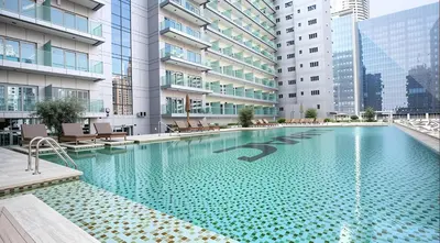an infinity pool in the middle of a building at Silk Valley - Luxury DAMAC Studio near Dubai Mall & Burj Khalifa in Dubai