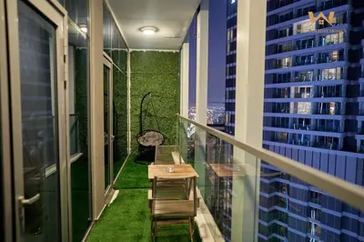 a balcony with a table and chairs on a balcony at Wake Up to the Burj Khalifa Stunning view 1BR Stay in Dubai