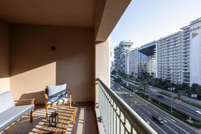 a balcony with a view of a highway at Spacious 1BR with Terrace l Near Palm Jumeirah Mall in Dubai