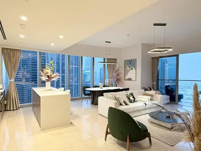 a living room with a couch and a table at UNIQUE - BURJ KHALIFA & FOUNTAIN ViEW-4 BR in Dubai