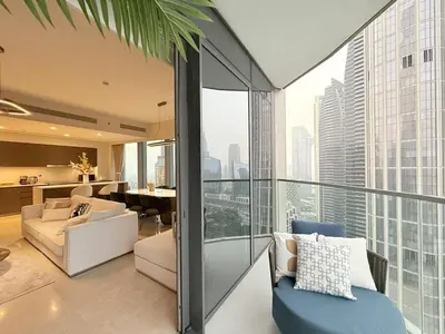 a living room with a view of a building at UNIQUE - BURJ KHALIFA & FOUNTAIN ViEW-4 BR in Dubai