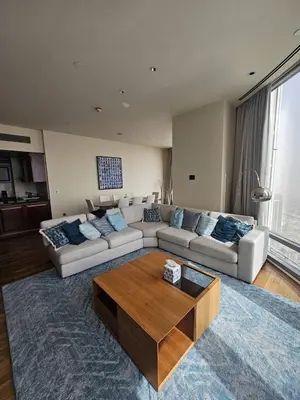 a living room with a couch and a coffee table at Apartment in the heart of Dubai - in Burj Khalifa in Dubai