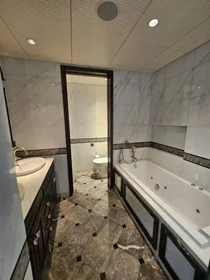 a large bathroom with a tub and a sink at Apartment in the heart of Dubai - in Burj Khalifa in Dubai