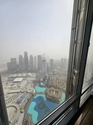 a view of a city from a window in a skyscraper at Apartment in the heart of Dubai - in Burj Khalifa in Dubai
