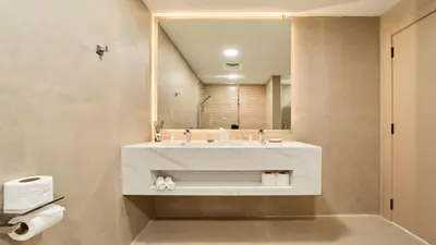 a bathroom with a white sink and a mirror at fam Living High Floor Stay in Sulafa Tower in Dubai