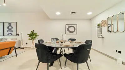 a dining room with a table and chairs at fam Living High Floor Stay in Sulafa Tower in Dubai
