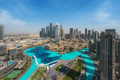 an aerial view of a city with tall buildings at Stunning Full Burj Khalifa and Fountain View Apartment in Dubai