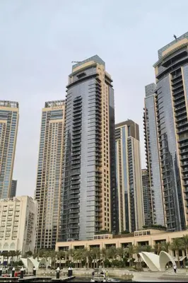 a group of tall buildings in a city at Spacious Luxury Apartment Stunning Creek Views Family Friendly in Dubai