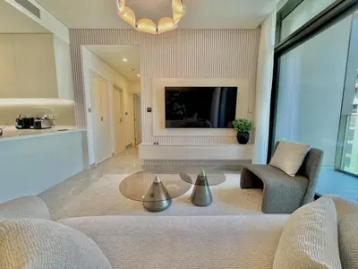 a living room with a couch and a table at Artistic 2Bedroom with Skyline Khalifa View in Dubai
