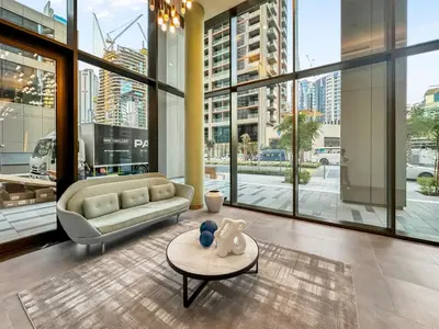 a living room with a couch and a table at Artistic 2Bedroom with Skyline Khalifa View in Dubai