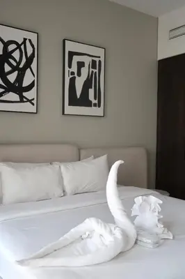 a white swan made out of towels on a bed at 1BR Madinat Jumeirah Living in Dubai