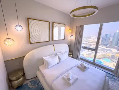 a hotel room with a bed and a large window at GRANDE SIGNATURE with a direct Burj Khalifa view and Private Fountain Show at 62nd floor with DXB AIRPORT VIP Shuttle option for 6 guests in Dubai