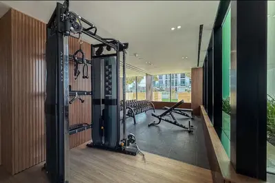 a room with a gym with a treadmill at Elegant Studio Stay in Binghatti Tulip Dubai in Dubai