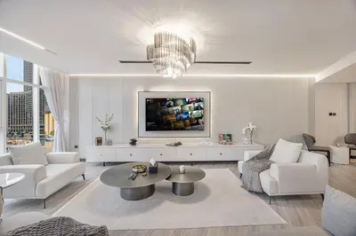 a living room with a couch and a table at Skyline Views with Waterfront & Marina Walk - 3 BDR Apartment in Dubai