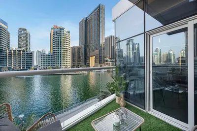 a balcony with a view of the water and a city at Skyline Views with Waterfront & Marina Walk - 3 BDR Apartment in Dubai