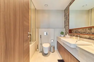 a bathroom with a toilet and a sink at fam Living Ultra Luxury 3BR Burj Khalifa View in Dubai