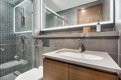 a bathroom with a sink and a shower at STAY BY LATINEM Luxury 1BR Plus Holiday Home CB 1412 Near Burj Khalifa in Dubai